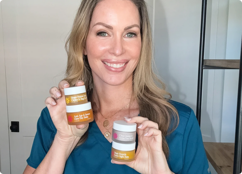 Dr. Becky Campbell holding the four Frøya balms