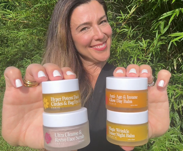 Dr. Francesca LeBlanc holding three Frøya balms