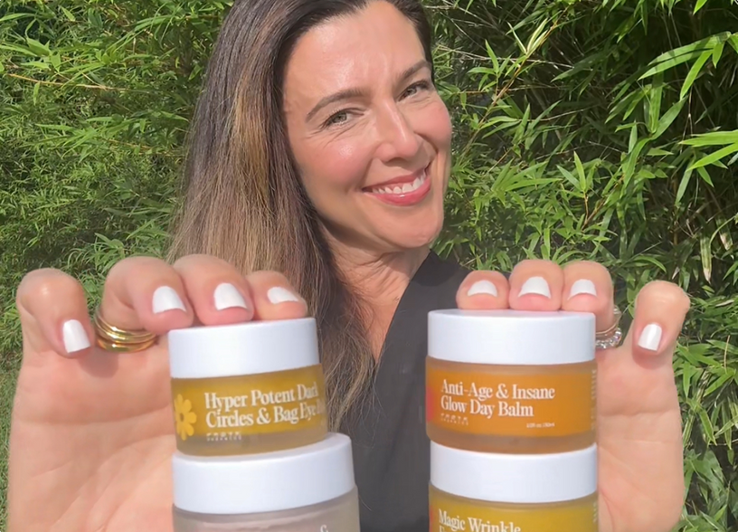 Dr. Francesca LeBlanc holding three Frøya balms